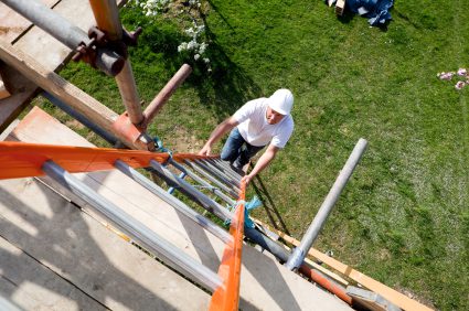Construction Site Worker Climbing Ladder