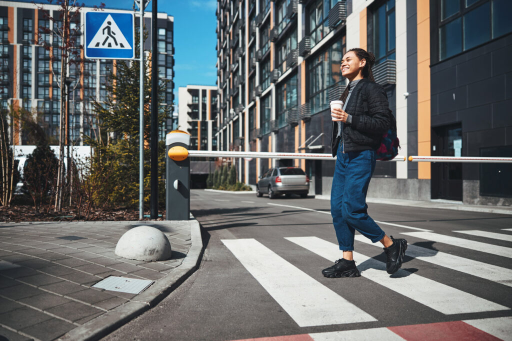 Beautiful woman with coffee in urban surrounding